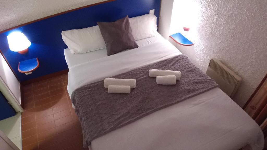 Postel nebo postele na pokoji v ubytování VVF Belle-Île-en-Mer