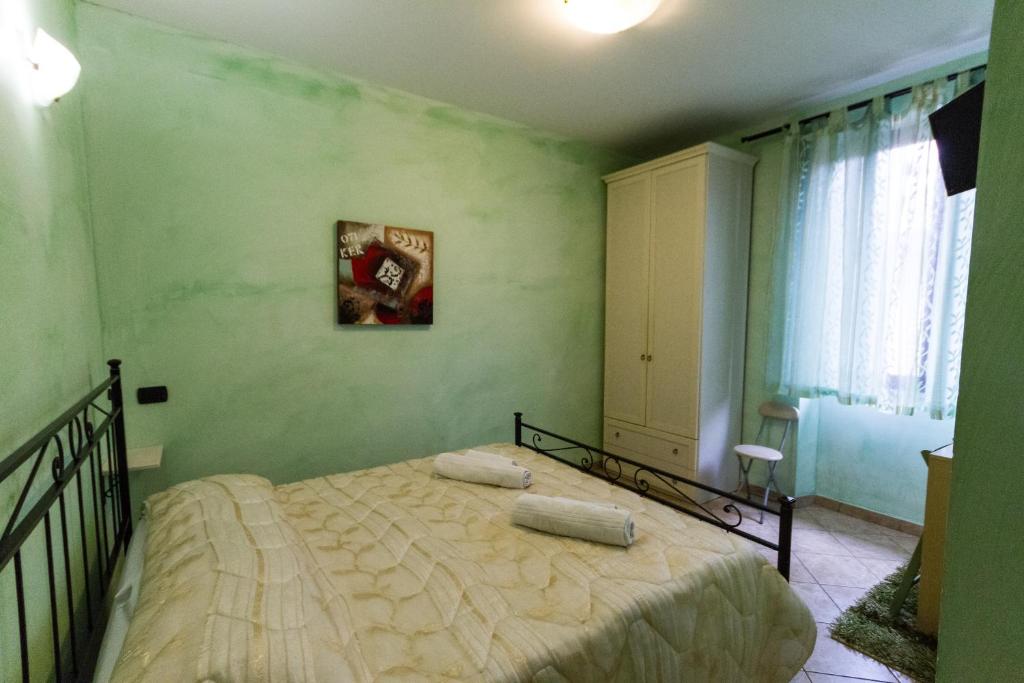 Postel nebo postele na pokoji v ubytování Camere La Basilica