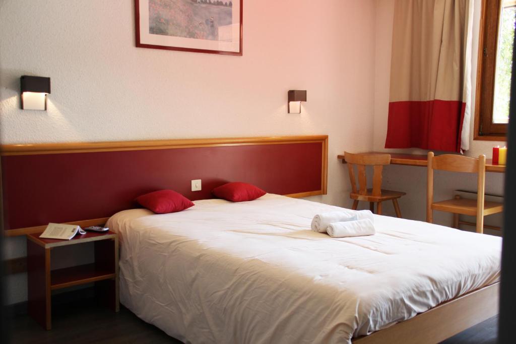 Postel nebo postele na pokoji v ubytování VVF Les Vosges Bitche
