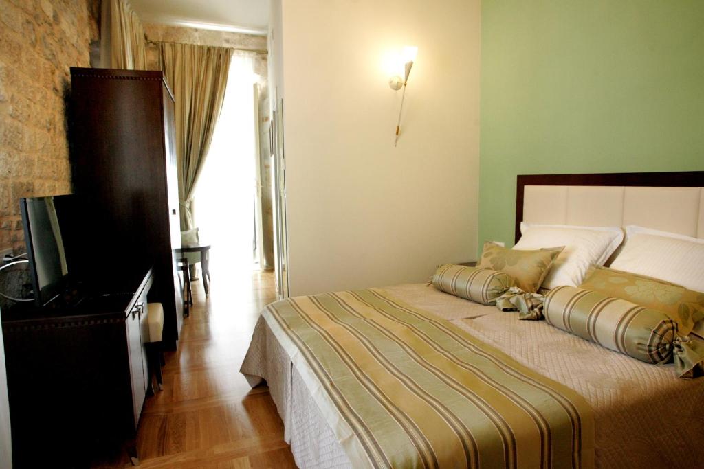 Postel nebo postele na pokoji v ubytování Palace Augubio