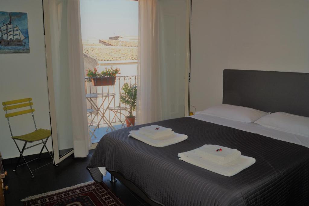 A bed or beds in a room at Guascone Apartments