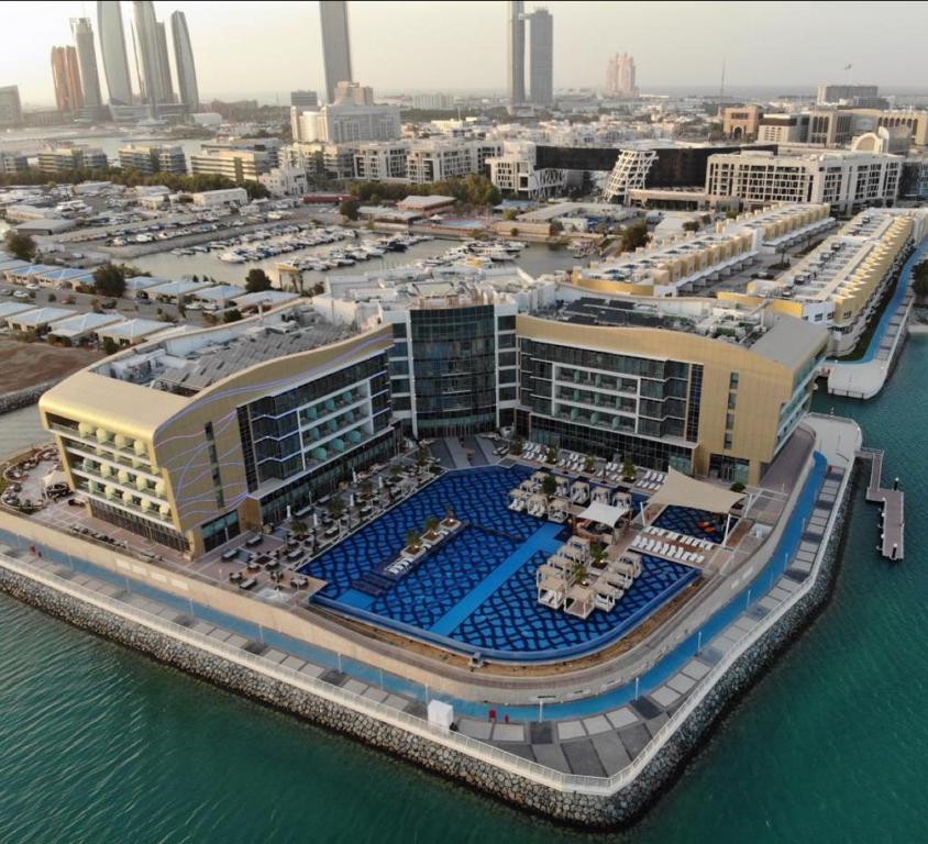 an aerial view of a marina in a city at Royal M Hotel & Resort Abu Dhabi in Abu Dhabi