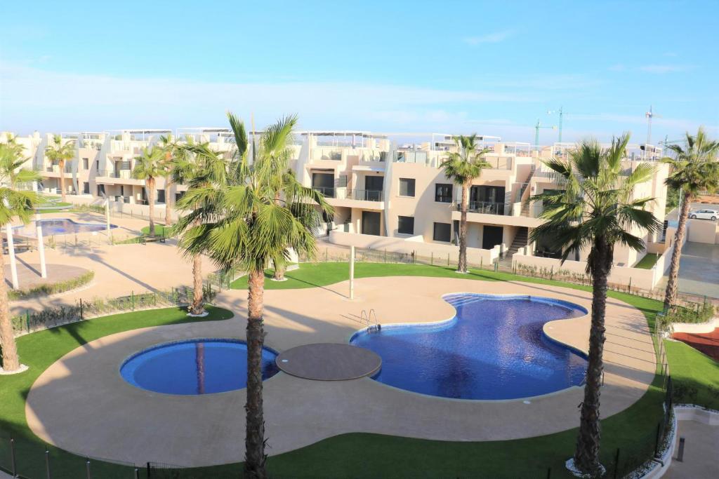 Bazén v ubytování Playa Elisa 3022 nebo v jeho okolí