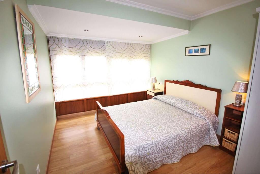 Postel nebo postele na pokoji v ubytování Casa Embalse da Fervenza