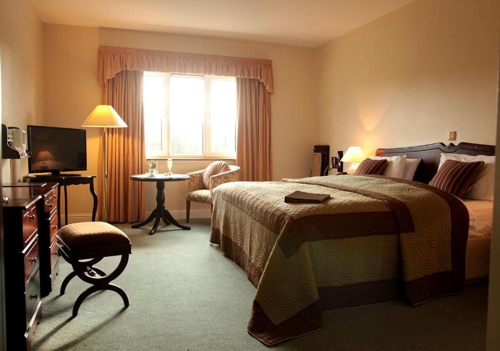 Ένα ή περισσότερα κρεβάτια σε δωμάτιο στο Springfort Hall Hotel