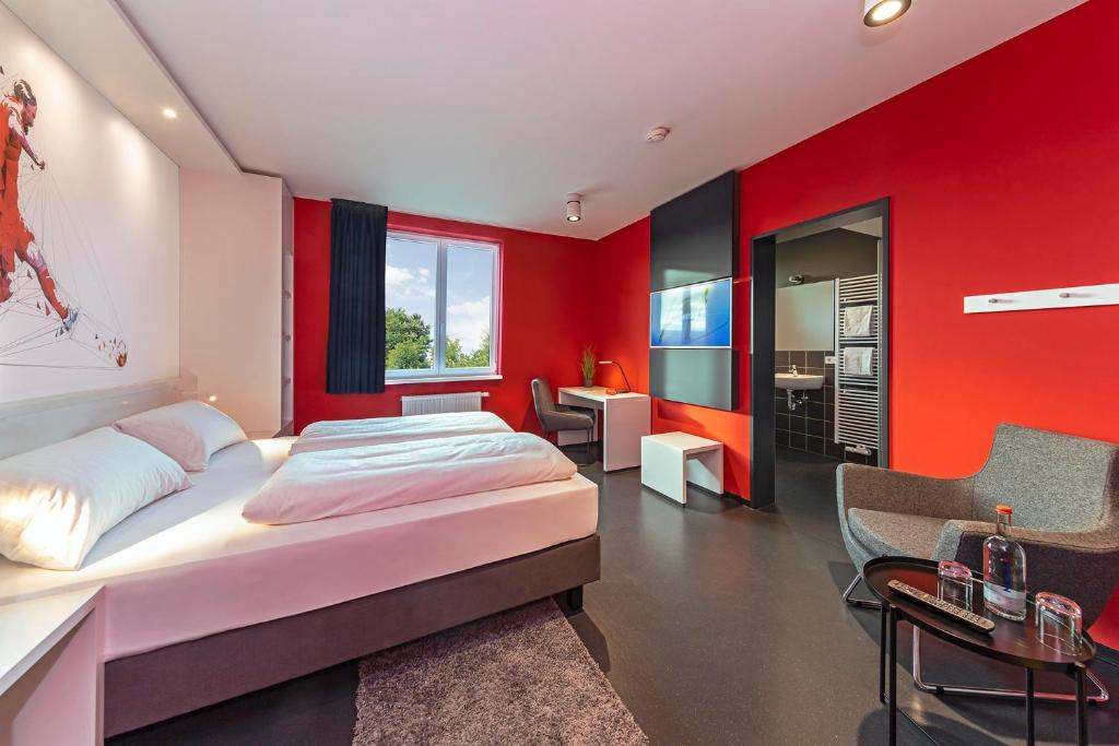 Säng eller sängar i ett rum på Hotel Athletik Kiel