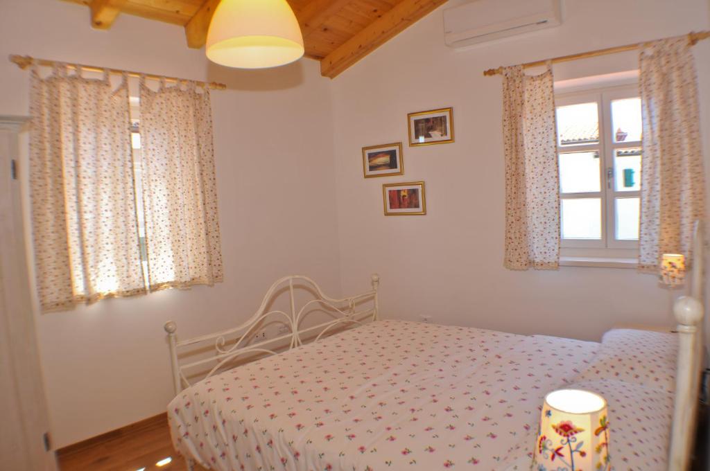 Postel nebo postele na pokoji v ubytování Villa Petra