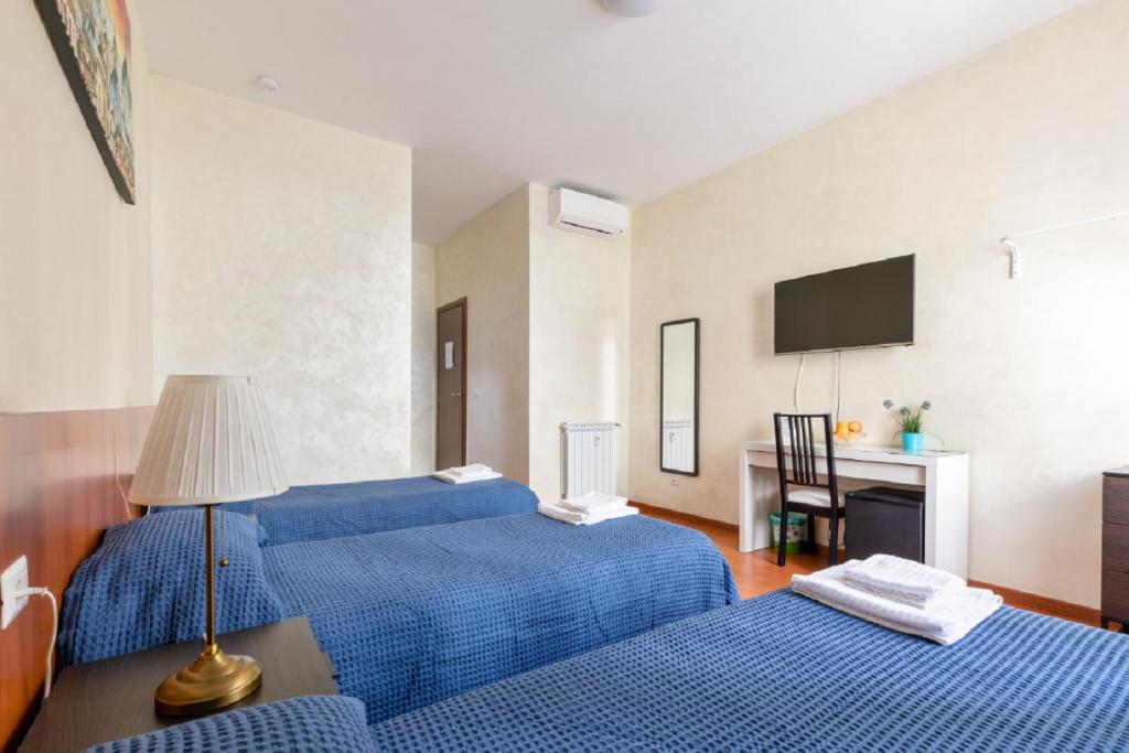 Posteľ alebo postele v izbe v ubytovaní Roma Enrico Guesthouse
