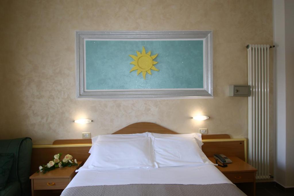 Postel nebo postele na pokoji v ubytování Hotel De Amicis