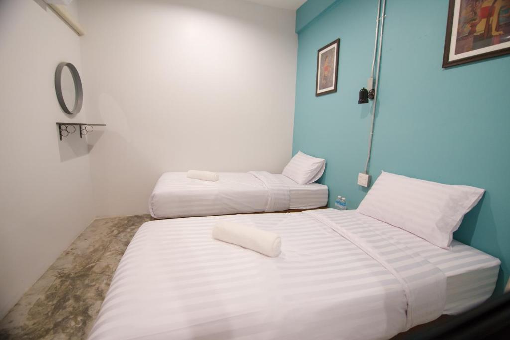 Postel nebo postele na pokoji v ubytování Suree House