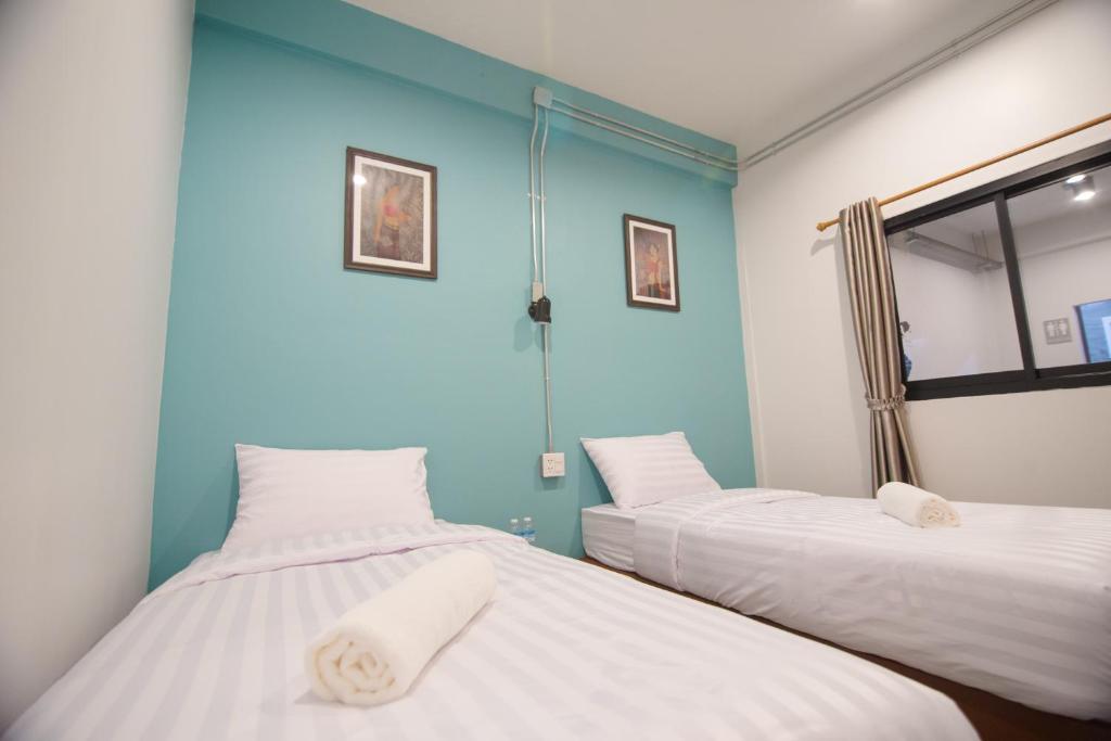 Postel nebo postele na pokoji v ubytování Suree House