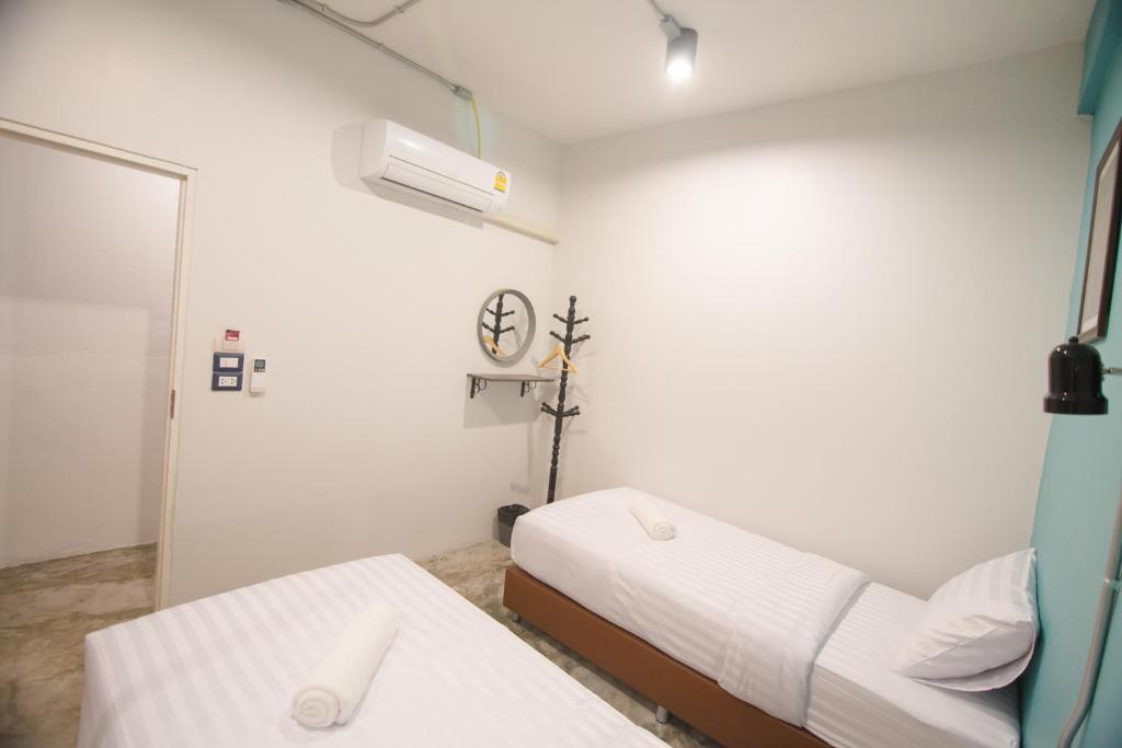 Postel nebo postele na pokoji v ubytování Suree House