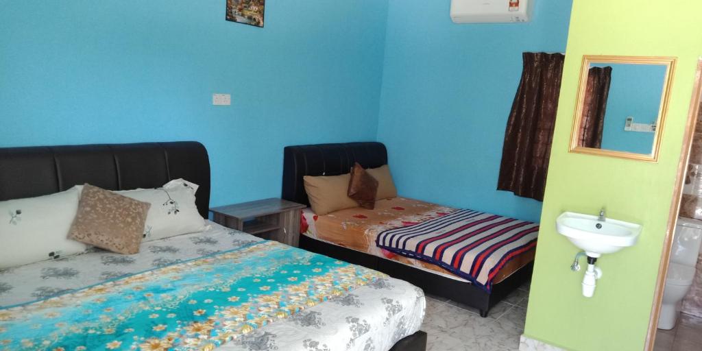 Postel nebo postele na pokoji v ubytování Mazza Nur Motel
