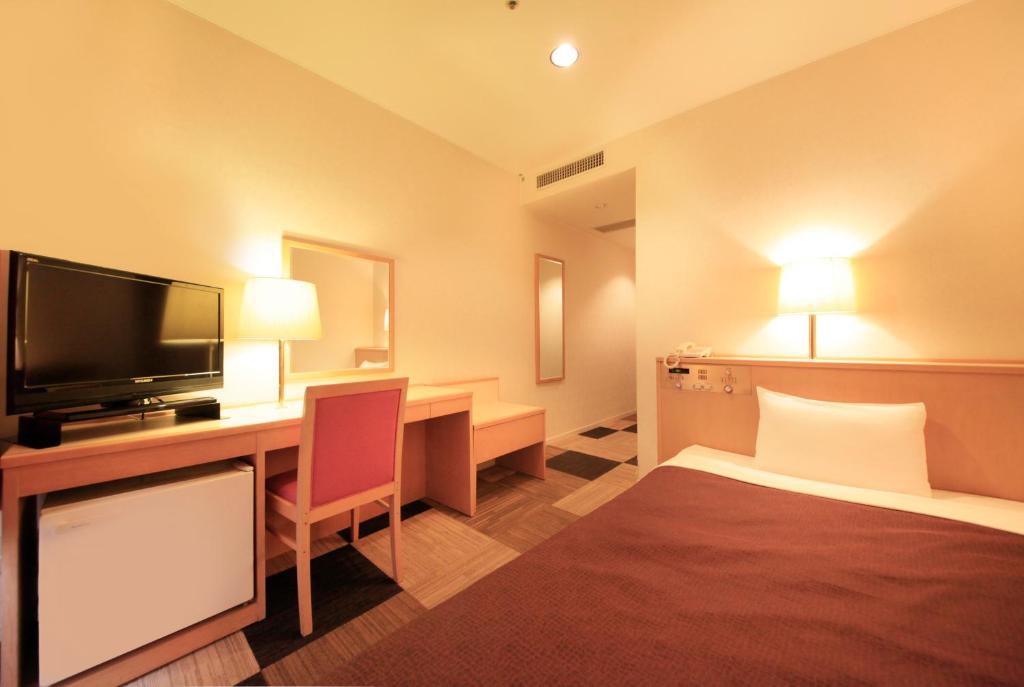 Postel nebo postele na pokoji v ubytování Quintessa Hotel Iseshima