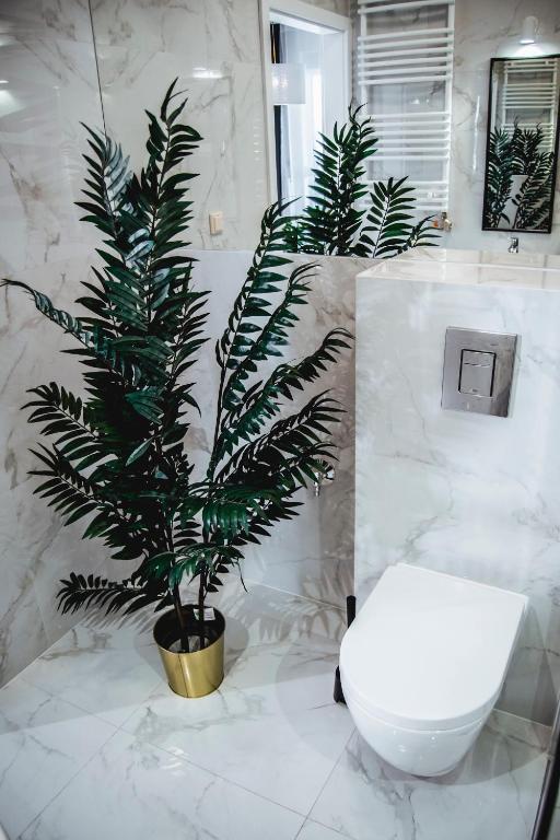 Kúpeľňa v ubytovaní Apartamenty Rakowicka WAWELOFTS