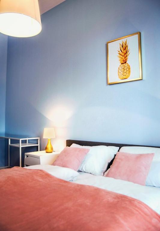 Posteľ alebo postele v izbe v ubytovaní Apartamenty Rakowicka WAWELOFTS
