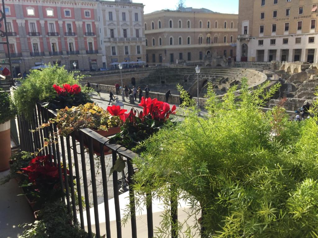 a view of a courtyard with flowers and buildings at Alvino Suite And Breakfast in Lecce