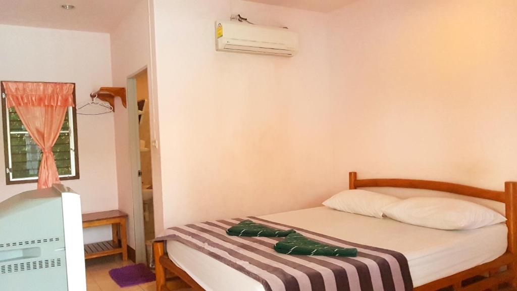 Postel nebo postele na pokoji v ubytování Tamarind Guesthouse