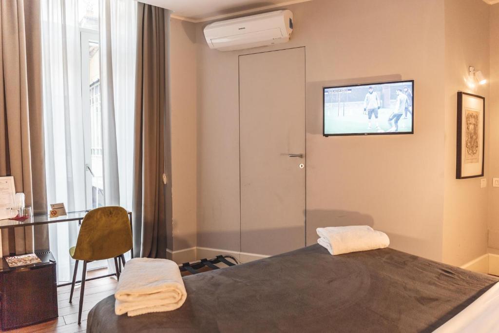 Postel nebo postele na pokoji v ubytování Relais Della Porta