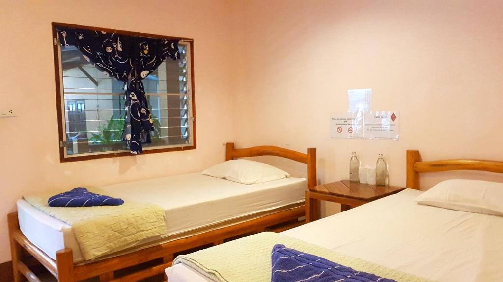 Postel nebo postele na pokoji v ubytování Tamarind Guesthouse