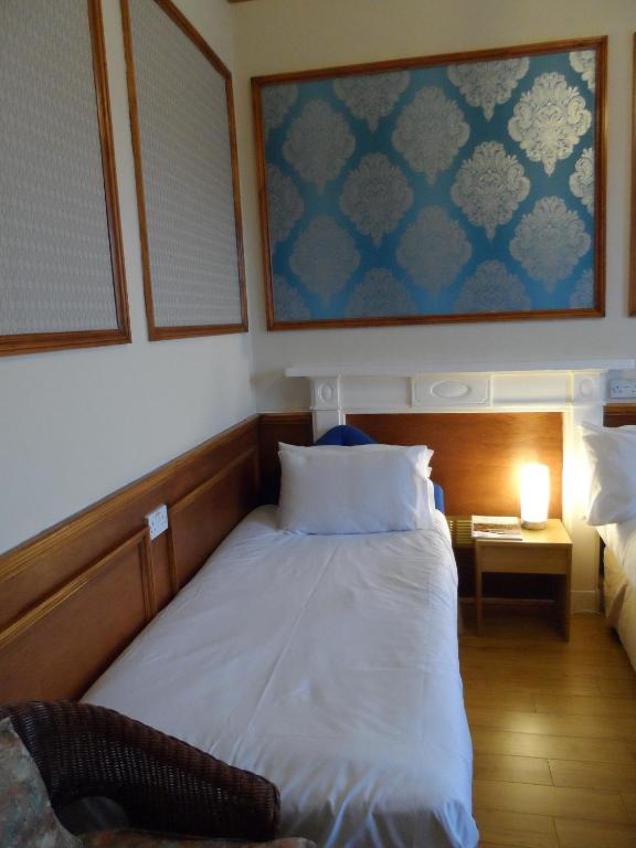 Postel nebo postele na pokoji v ubytování Minto House