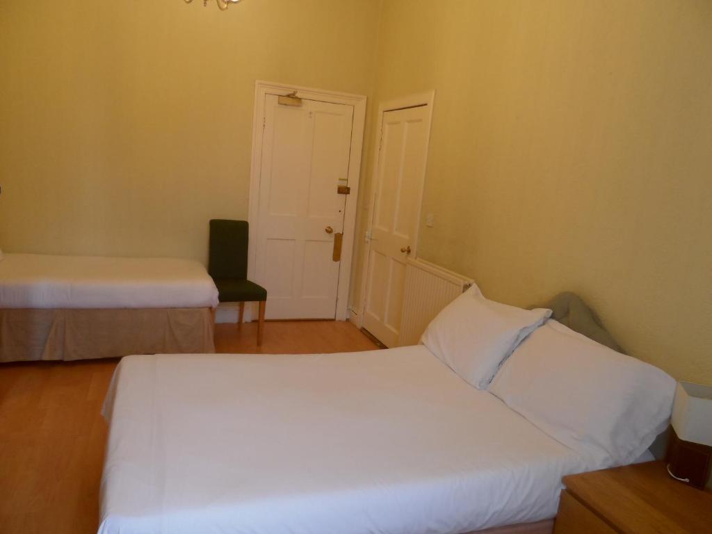 Postel nebo postele na pokoji v ubytování Minto House