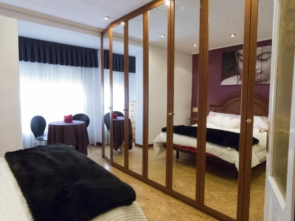 Postel nebo postele na pokoji v ubytování IKIGAI wifi , Neflitx
