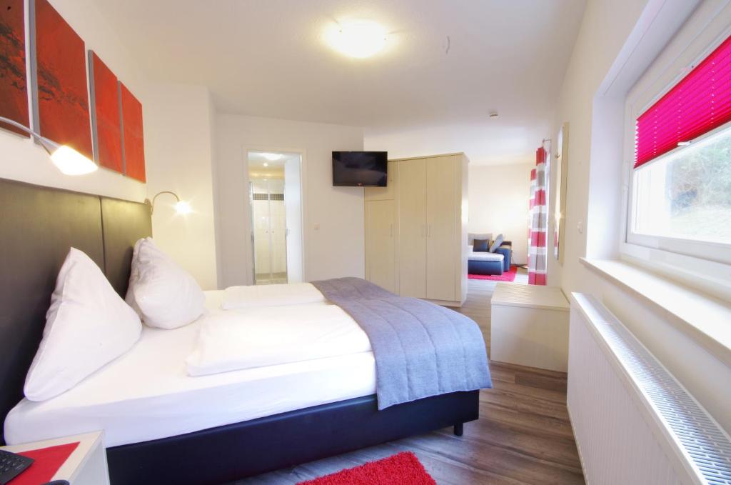 Postel nebo postele na pokoji v ubytování Hotel Jakob