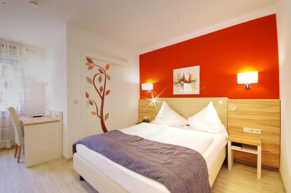Postel nebo postele na pokoji v ubytování Hotel Jakob