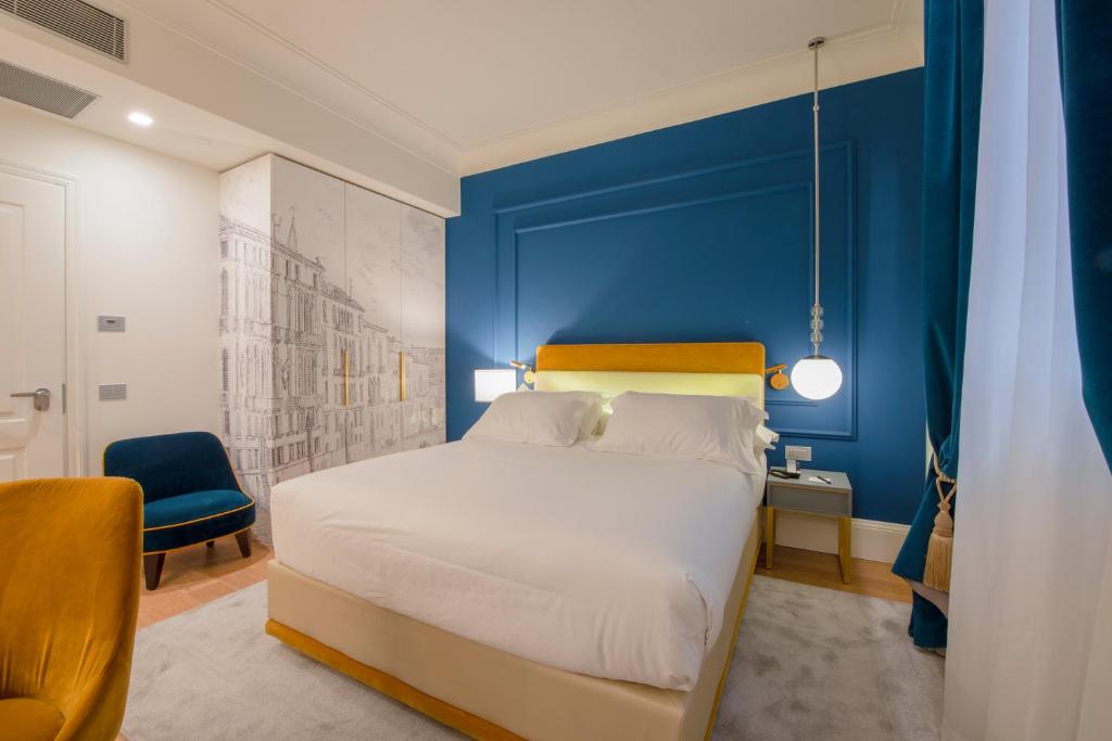 Postel nebo postele na pokoji v ubytování H10 Palazzo Canova