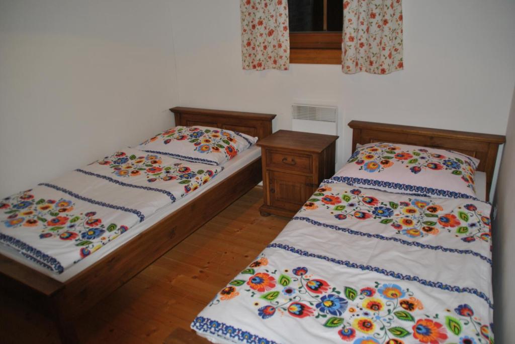 Postel nebo postele na pokoji v ubytování Drevenica Viki