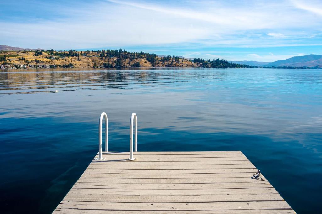 a dock on a lake with a view of the water at Cabana #11 in Chelan