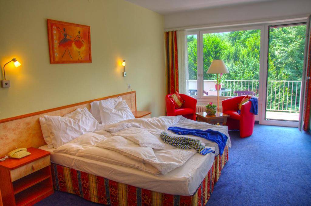 Postel nebo postele na pokoji v ubytování Hotel Excelsior