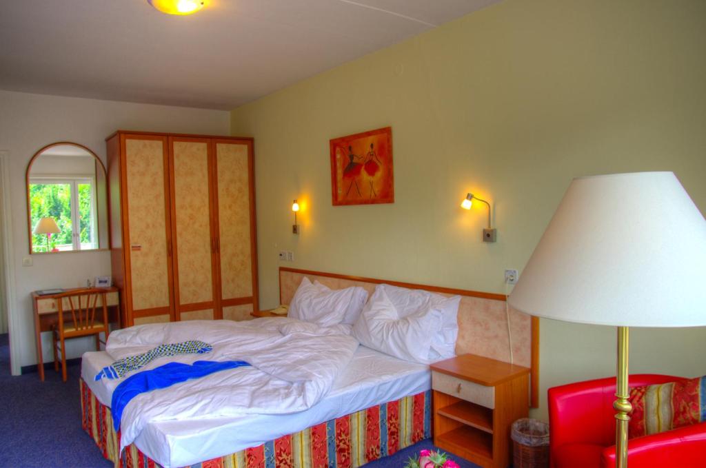 Postel nebo postele na pokoji v ubytování Hotel Excelsior
