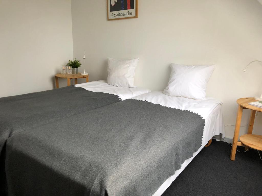Cama o camas de una habitación en Tune Kursuscenter