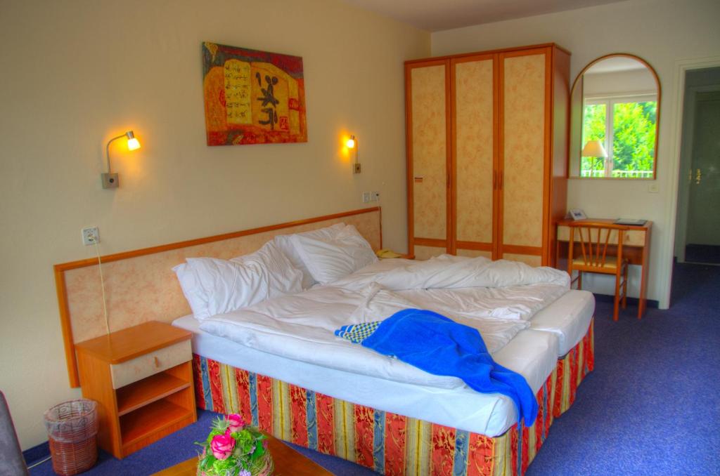 Postel nebo postele na pokoji v ubytování Hotel Excelsior
