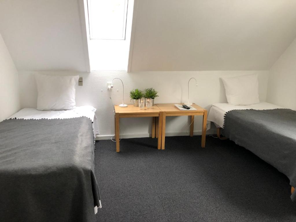 Cama o camas de una habitación en Tune Kursuscenter