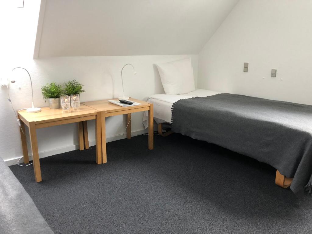 Cama o camas de una habitación en Tune Kursuscenter
