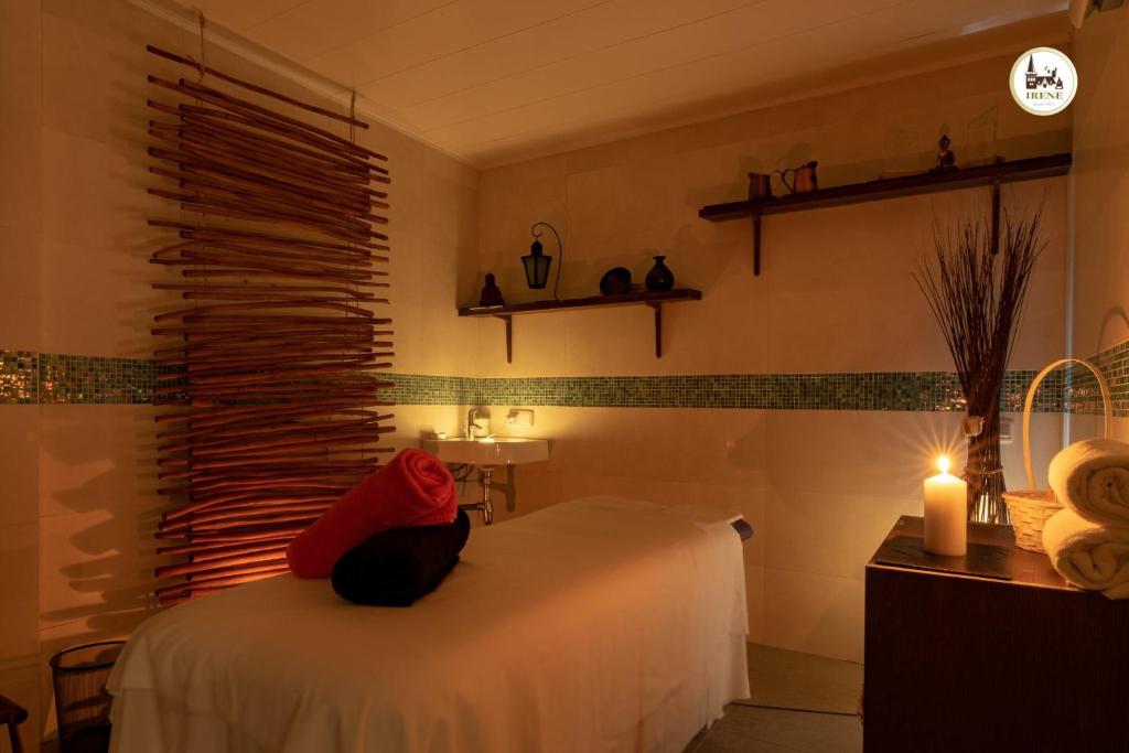 Postel nebo postele na pokoji v ubytování Hotel & Spa Casa Irene