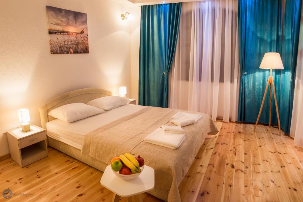 En eller flere senger på et rom på Apartments Vila Marija