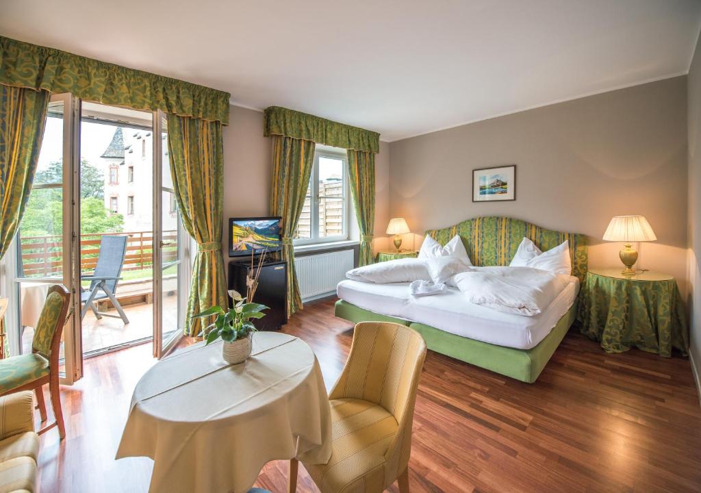 Säng eller sängar i ett rum på Dominik Alpine City Wellness Hotel - Adults only