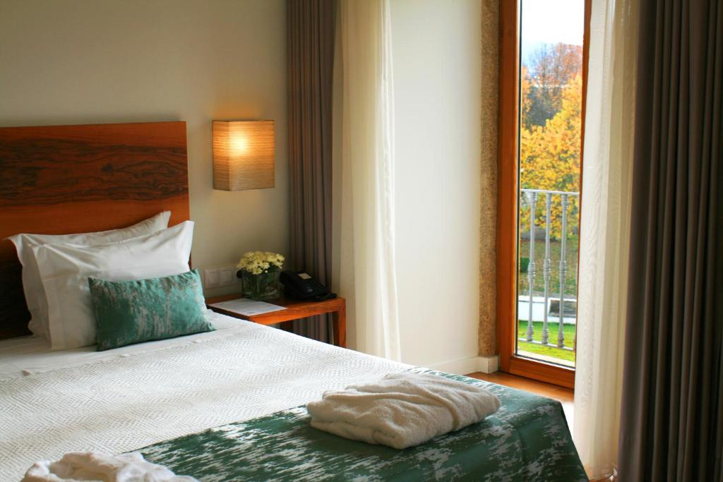 Uma cama ou camas num quarto em Convento Da Serta Hotel