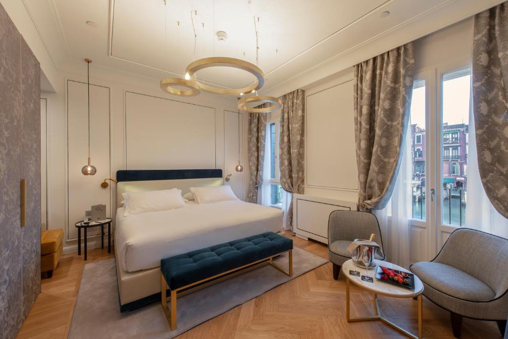 Postel nebo postele na pokoji v ubytování H10 Palazzo Canova