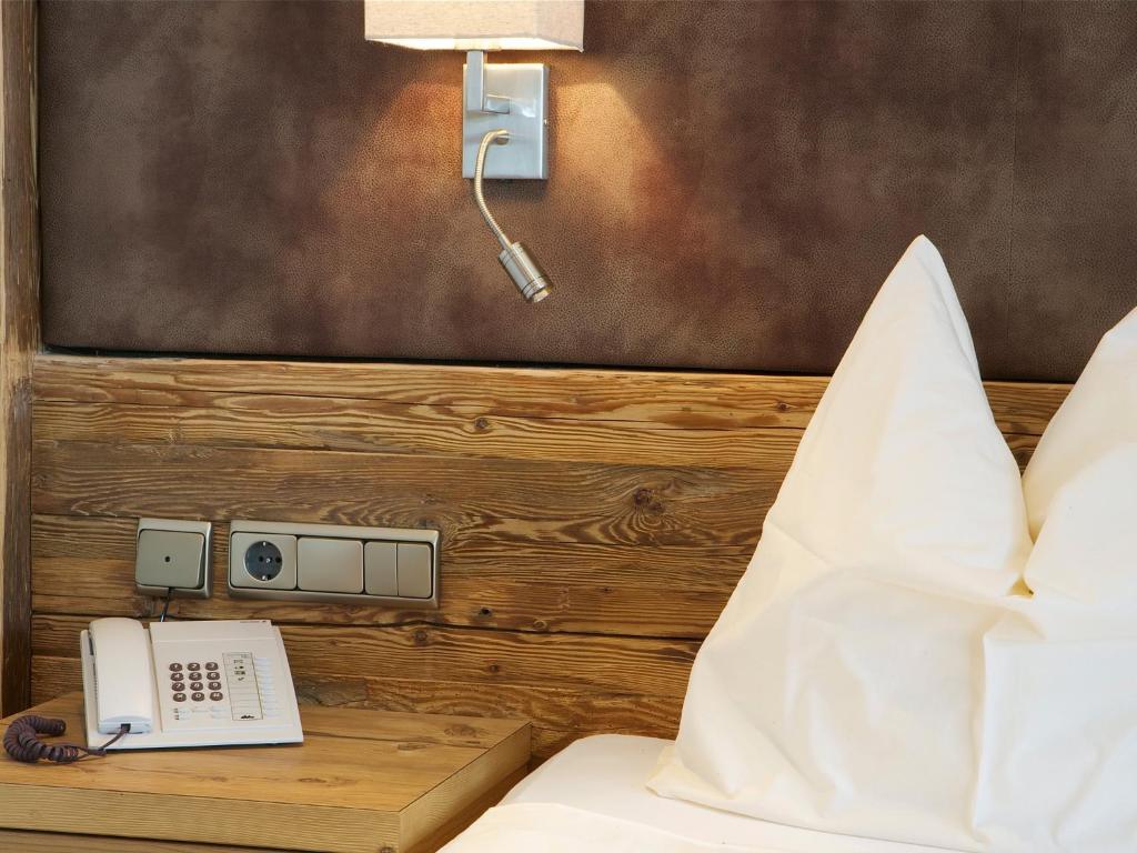 Postel nebo postele na pokoji v ubytování Hotel Alexander