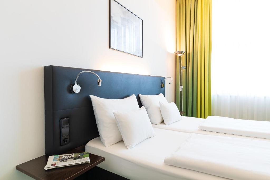 Letto o letti in una camera di Rainers Hotel Vienna