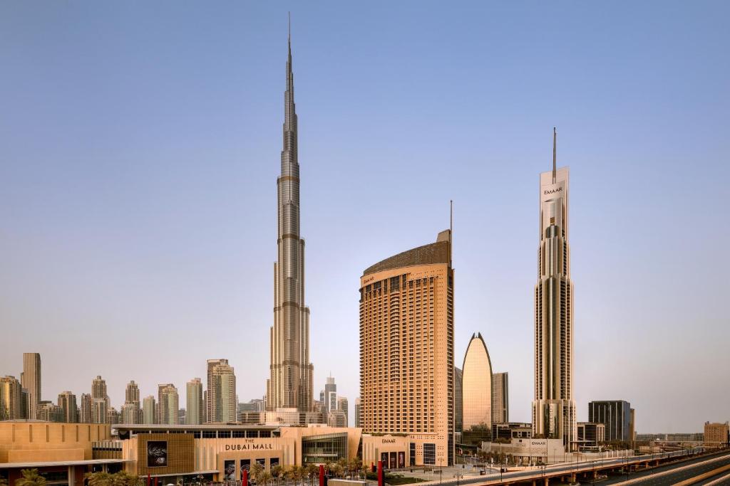 a view of a city with two tall buildings at Kempinski Central Avenue Dubai in Dubai