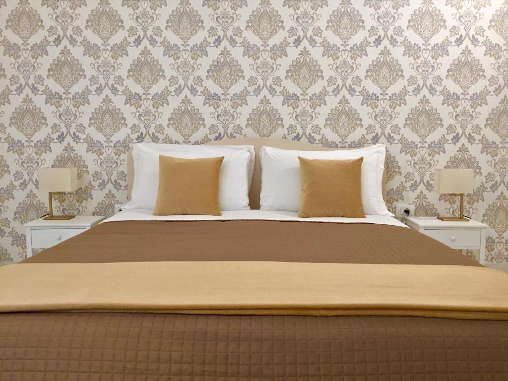 Postel nebo postele na pokoji v ubytování Dimora San Biagio Suites&Apartment