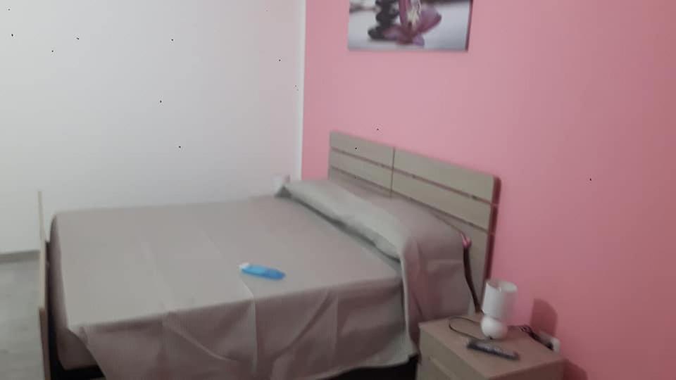 Postel nebo postele na pokoji v ubytování B&b Domo e Nonna