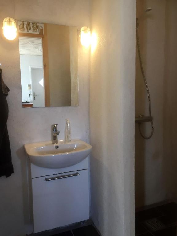 Koupelna v ubytování Købmandsgården 1
