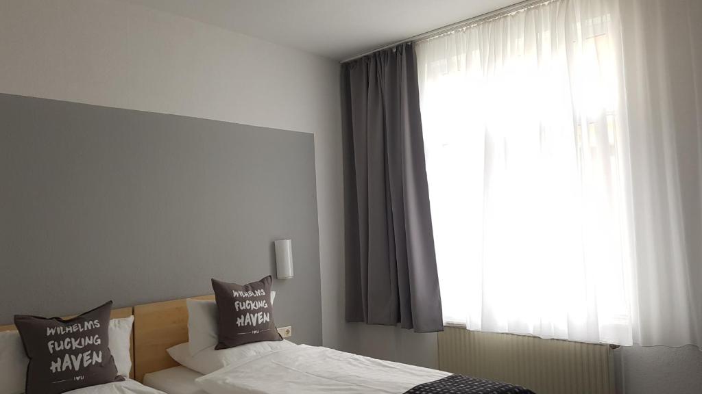 Postel nebo postele na pokoji v ubytování Hotel Keil